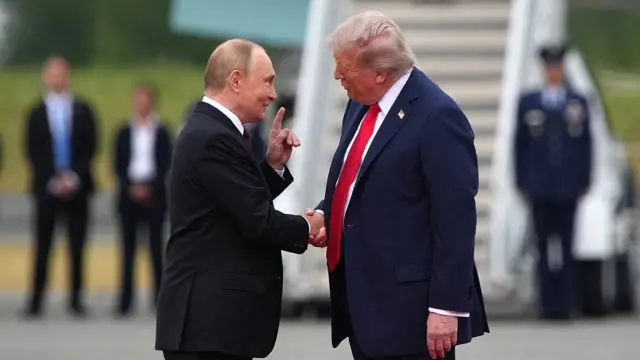 U.S. President Donald Trump (R) greets Russian President Vladimir Putin and Donald Trump speaks as they arrive at Joint Base Elmendorf-Richardson on 15 August 2025 in Anchorage, Alaska.