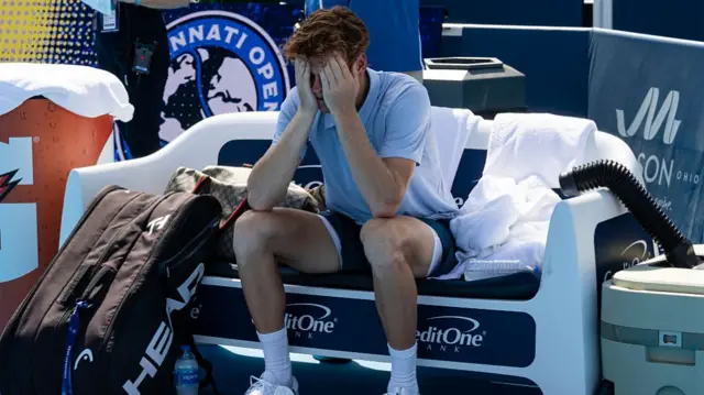 Jannik Sinner with his head in his hands during the Cincinnati Open final on Monday