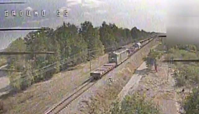 A picture of CCTV footage of a train on a track
