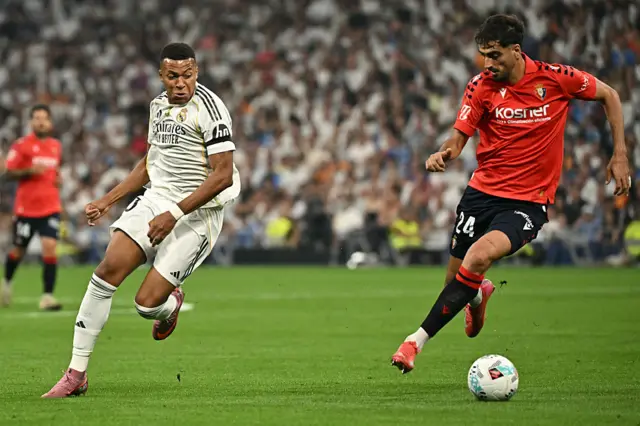 Kylian Mbappe running with the ball