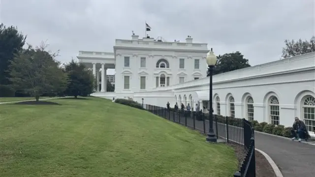 The side of the White House with its lawn in view