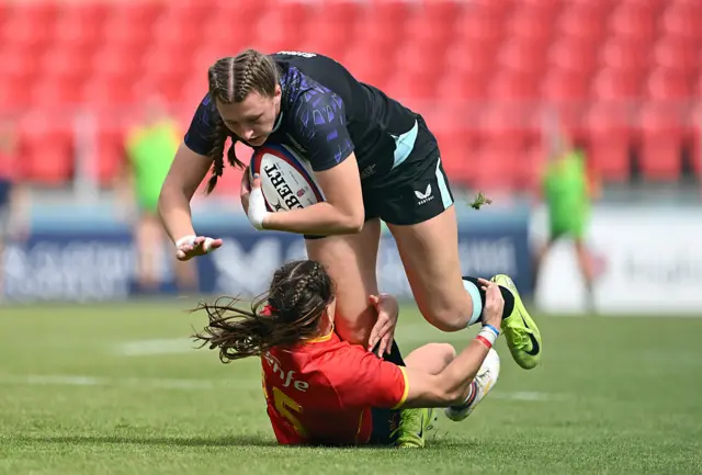 England and Spain players in tackle