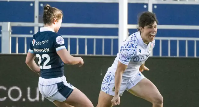 Italy score a try against Scotland
