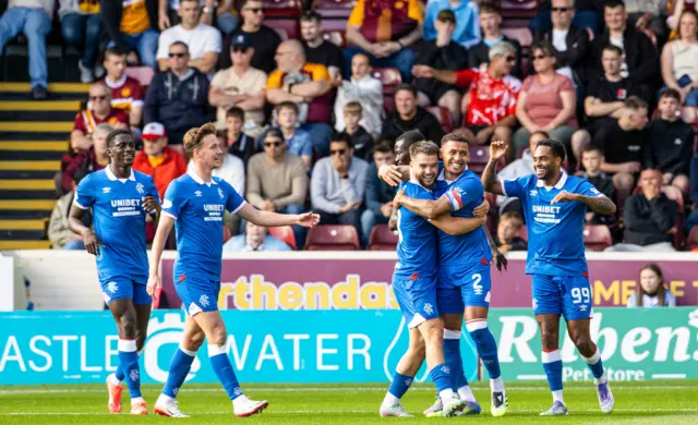 Tavernier celebrates with his teammates after heading Rangers into the lead