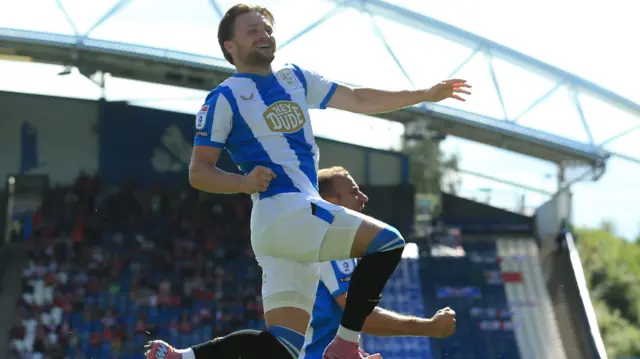 Alfie May celebrates