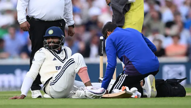 Ravindra Jadeja gets treatment on a toe injury