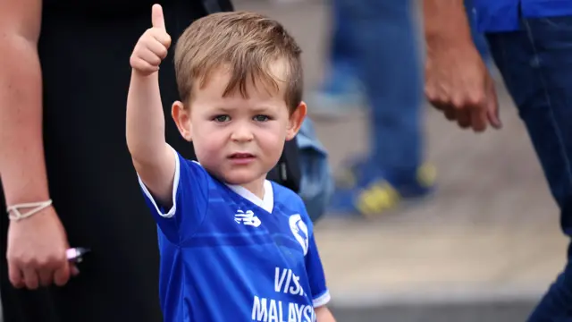 Young Cardiff fan puts his thumb up