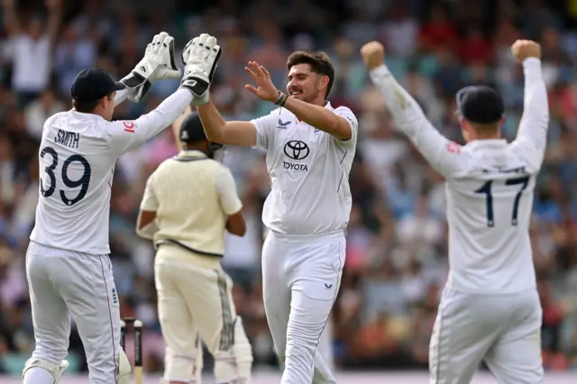 Josh Tongue celebrates a wicket