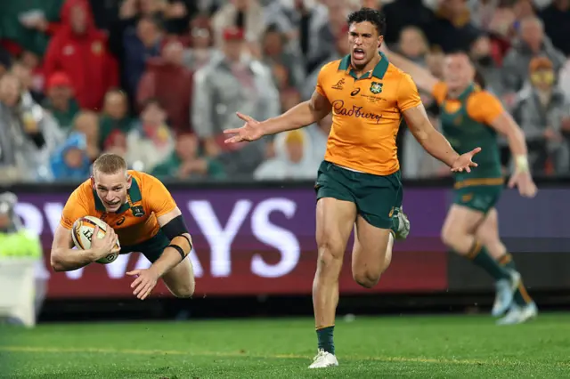 Max Jorgensen of the Wallabies dives over