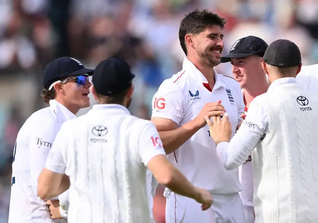 Josh Tongue celebrates a wicket