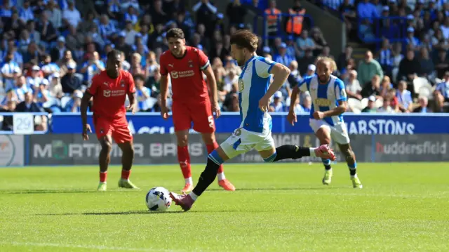 Alfie May scores a penalty for Huddersfield