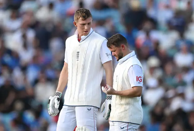 Ben Duckett looks at his hand after taking a blow