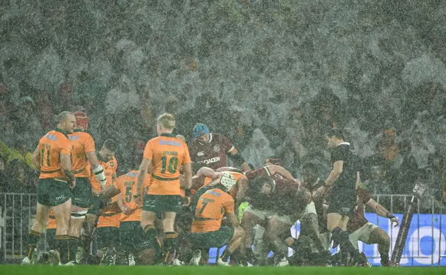 The weather was the main play of the half, the wallabies in control showing slick handling skills in torrential rain
