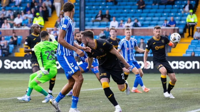 Livingston's Mo Sylla (left) deflects the ball into his own net