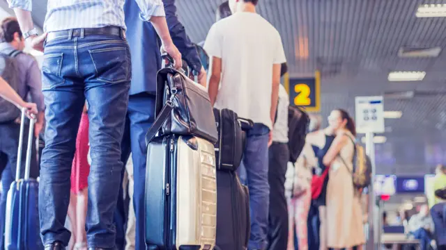A group of people in an airport.