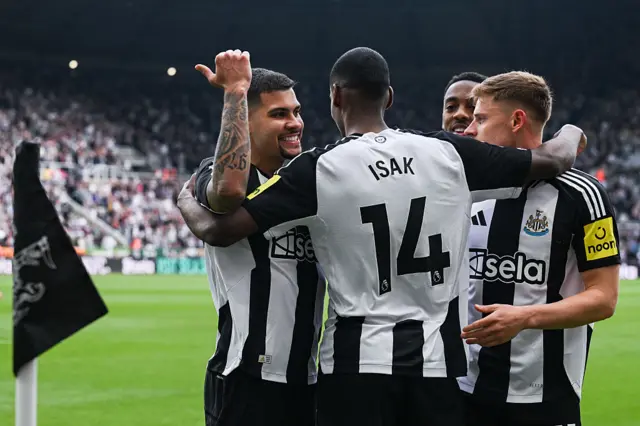 Newcastle players celebrate with Alexander Isak