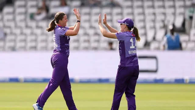 Grace Ballinger of Northern Superchargers celebrates with team mate Annabel Sutherland after taking the wicket of Kira Chathli of London Spirit during the The Hundred