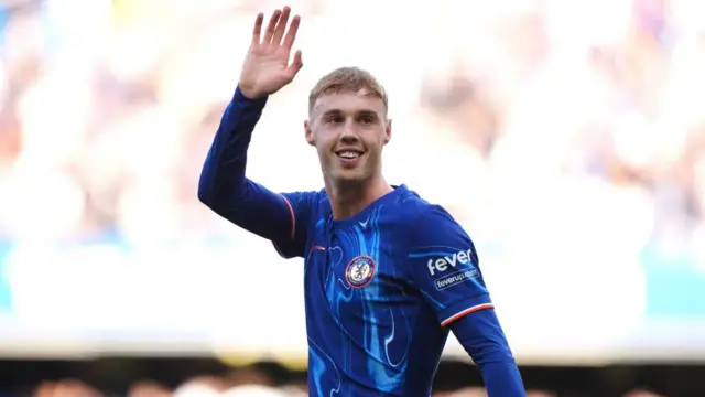 Cole Palmer in Chelsea kit waving
