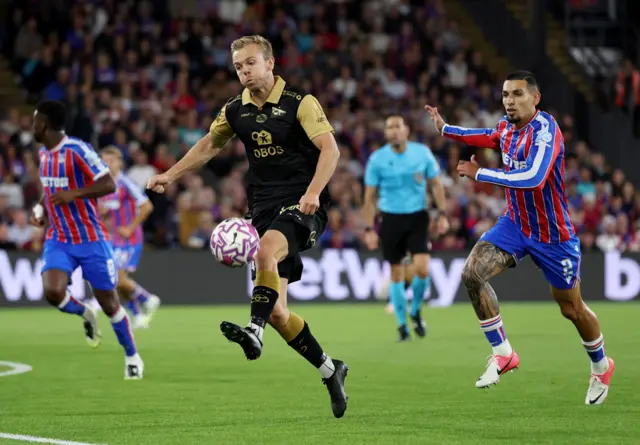 Molde controls the ball just outside the Palace box