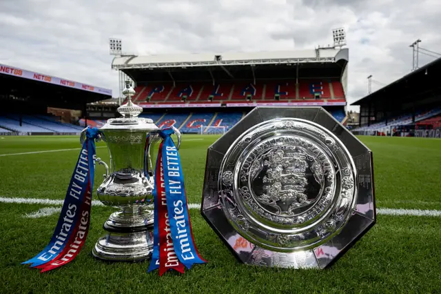 FA Cup and Community Shield trophies sit pitchside at Selhurst Park
