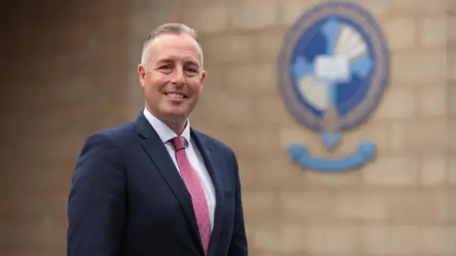 Education Minister Paul Givan at Rathmore Grammar School in Finaghy, Belfast, as students receive their A-level results. Picture date: Thursday August 14, 2025.