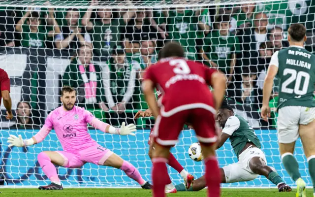 Hibernian's Rocky Bushiri handles the ball in the box, conceding a penalty following a VAR check