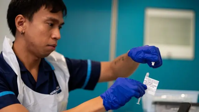 Keenjee Nama, senior research nurse holds an injection of a BioNTech mRNA cancer immunotherapy for non-small cell lung cancer (NSCLC) - known as BNT116 - at the University College London Hospital clinical research facility in central London. Picture date: Tuesday August 20, 2024.