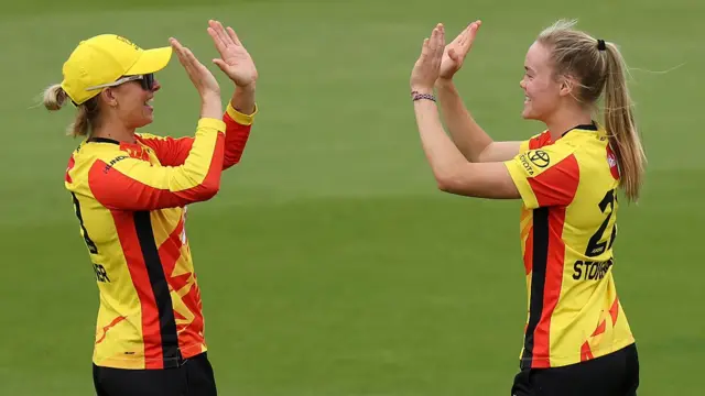 Alexa Stonehouse of Trent Rockets celebrates with teammate Ash Gardner after picking up her first wicket
