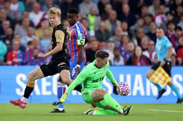 Henderson who has to race to the other of his box to stop a dangerous Fredrikstad long ball.
