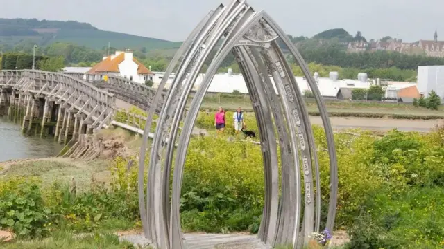 The memorial arches in Shoreham in front of the bridge and River Adur