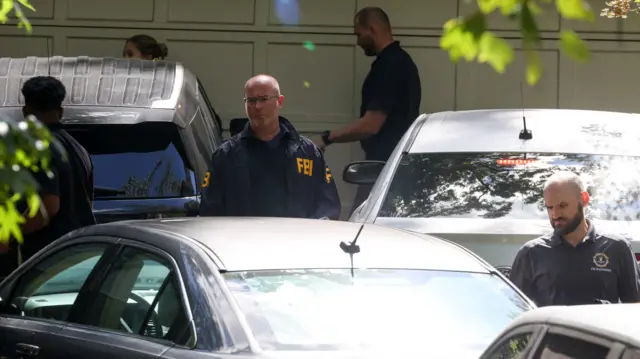 FBI officials get into cars