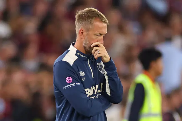 Graham Potter manager / head coach of West Ham United looks dejected during the Premier League match between West Ham United and Chelsea at London Stadium on August 22, 2025 in London, England.