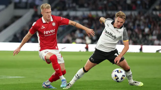 Bristol City's Ross McCrorie and Derby's Liam Thompson battle for the ball