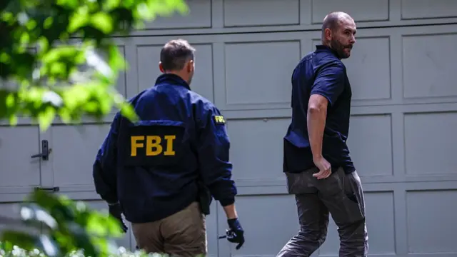 FBI agents outside Bolton's garage