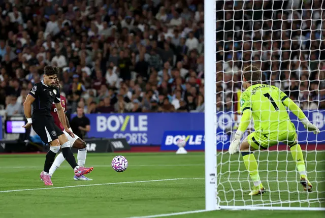 Pedro Neto of Chelsea scores his team's second goal during the Premier League match between West Ham United and Chelsea at London Stadium on August 22, 2025 in London, England.