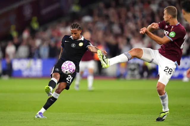 Chelsea's Joao Pedro (left) attempts a shot on goal during the Premier League match at London Stadium, London.