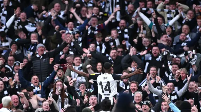 Alexander Isak celebrates with Newcastle fans