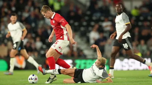 Andi Weimann attempts to tackle Rob Atkinson