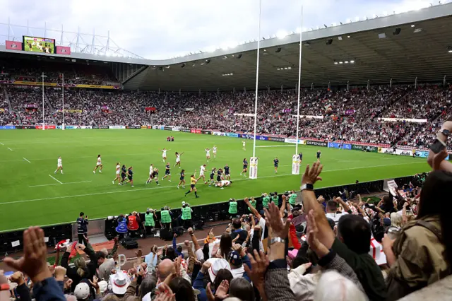 The crowd celebrates Hannah Botterman's try