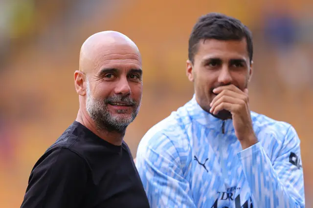 Pep Guardiola and Rodri