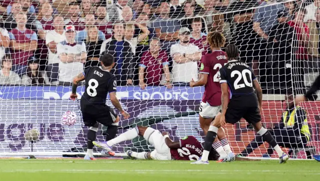 Chelsea's Enzo Fernandez scores their side's third goal of the game during the Premier League match at London Stadium, London