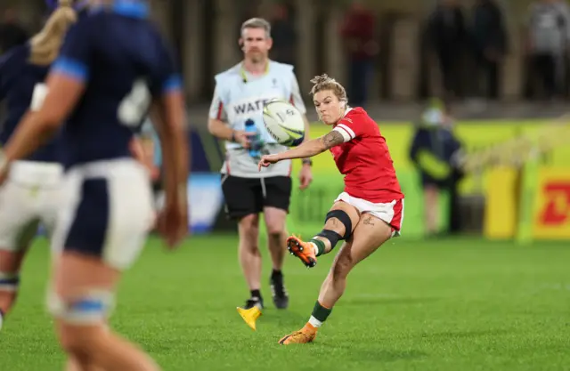 Keira Bevan kicks a penalty to win the game for Wales against Scotland at the 2022 World Cup