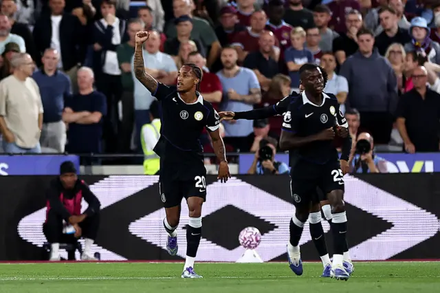 Chelsea's Brazilian striker #20 Joao Pedro (L) celebrates scoring the team's first goal.