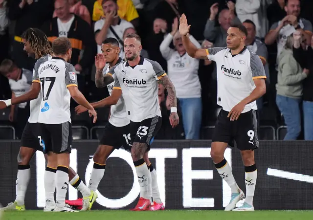 Carlton Morris celebrates his equaliser for Derby
