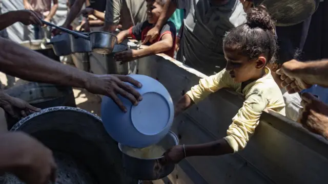 A child receives food aid in Gaza (file picture from July 2025)