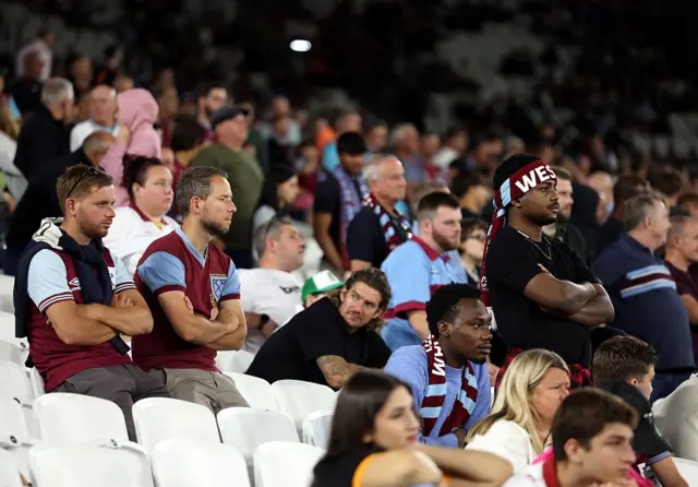 West Ham United fans look dejected as they watch the match during the Premier League match between West Ham United and Chelsea at London Stadium on August 22, 2025 in London, England.