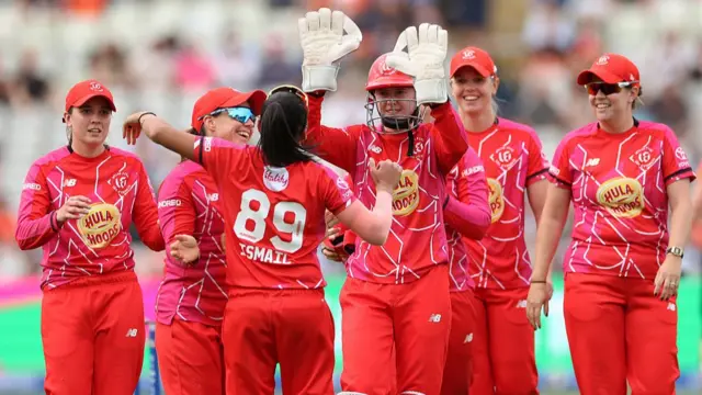 Shabnim Ismail of Welsh Fire celebrates with teammate Sarah Bryce after taking the catch to dismiss Sterre Kalis