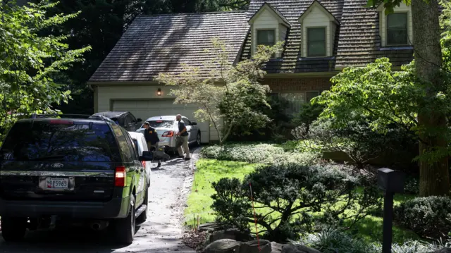 Cars parked outside John Bolton's home