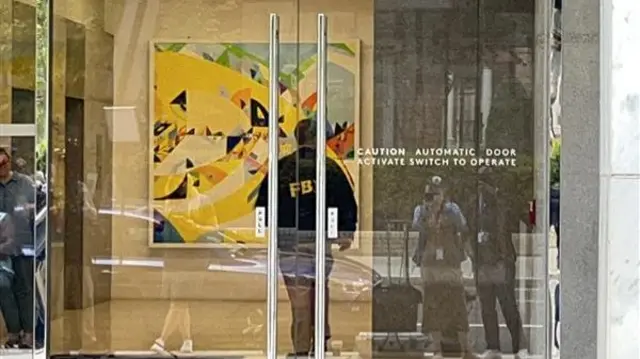 An FBI agent is seen in a Washington DC office building