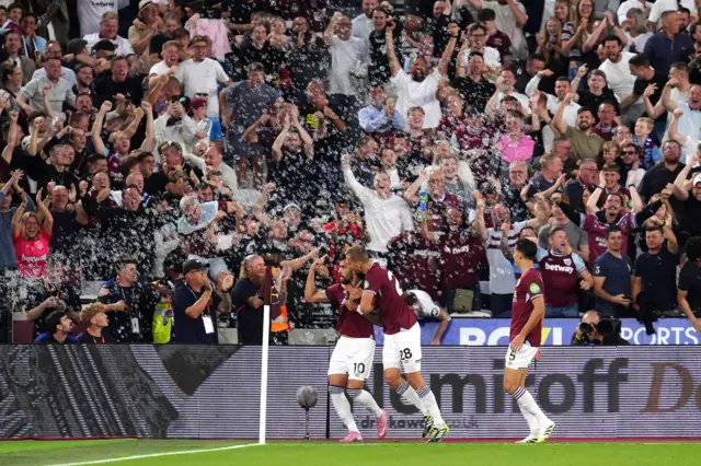 West Ham United's Lucas Paqueta (left) celebrates scoring their side's first goal of the game during the Premier League match at London Stadium, London.